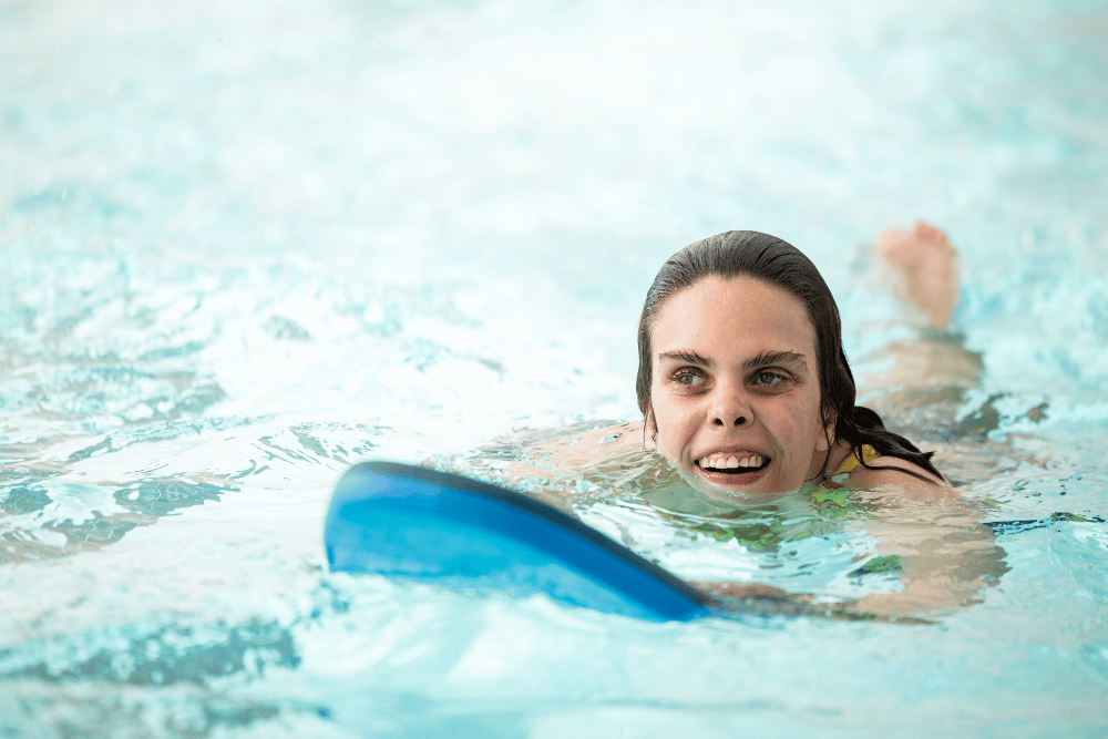 Alex swimming in a pool