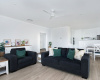 Living room view with kitchen in the background - Couches and open living