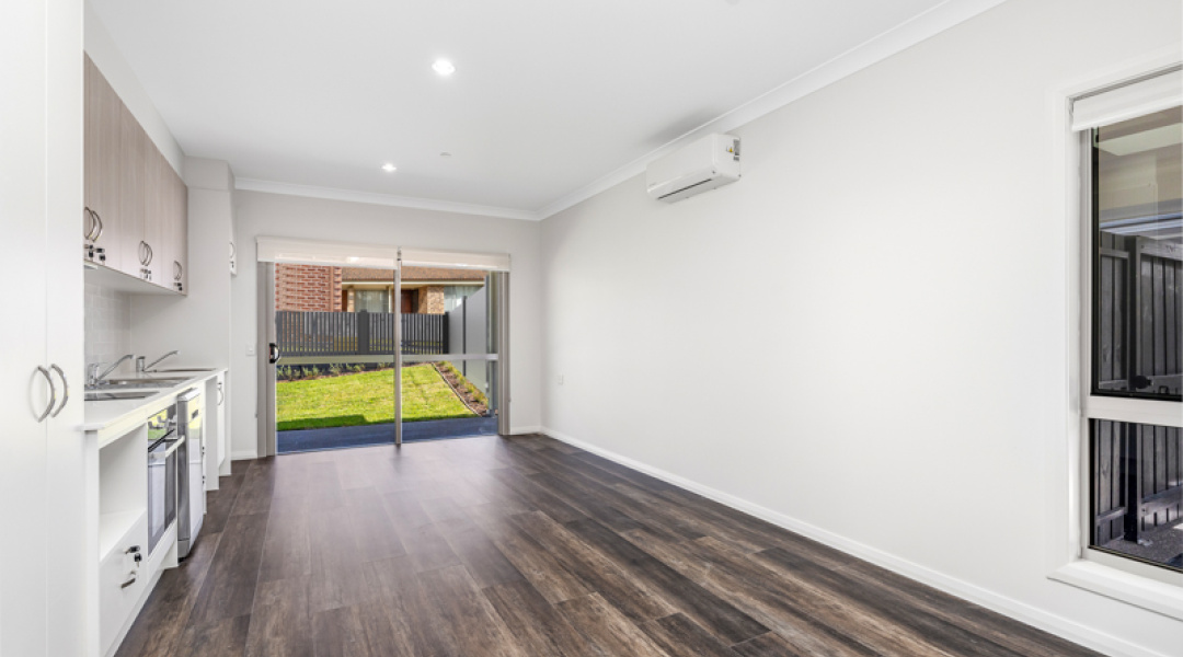 Vacant Private living room with access to backyard