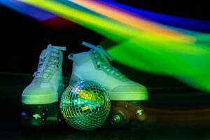 A Pair of White Shoes With Disco Balls